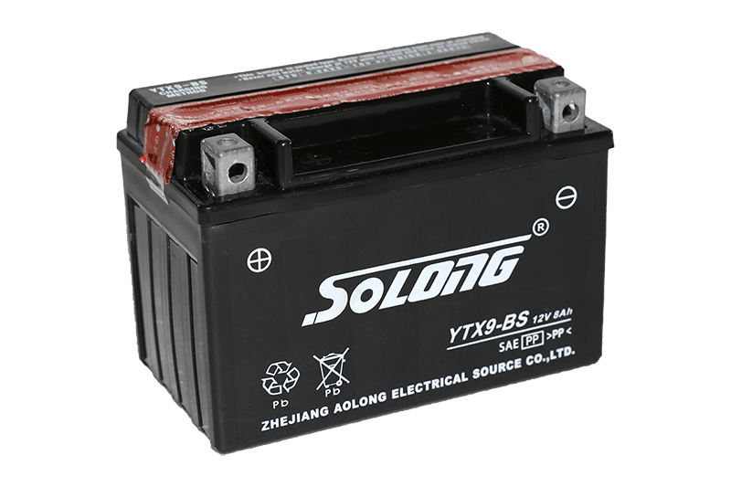 What is the difference between a maintenance-free battery and a liquid-filled battery?